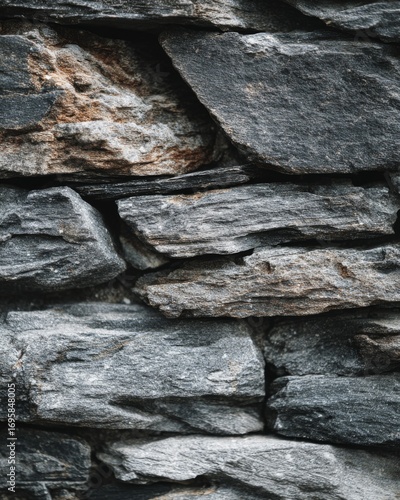 Close-up of rough stone wall texture, natural minimal surface.