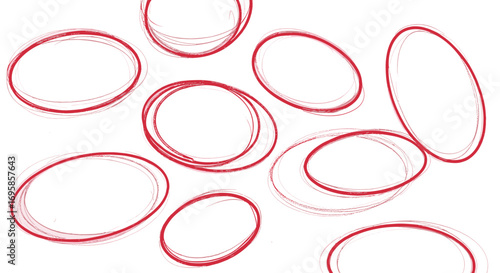 A collection of red and gray oval shapes scattered on a white surface
