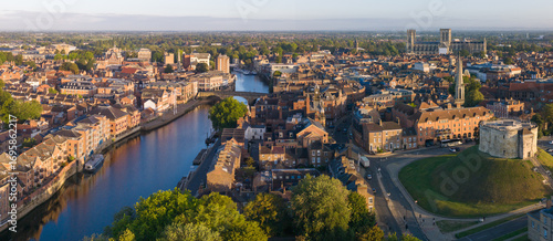 Quadro su tela Panoramic aerial view of York showing Clifford’s Tower, River Ouse, historic rooftops, and York Minster in morning light