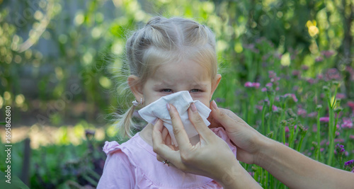 Obraz na płótnie Sad little girl with allergy symptoms outdoors