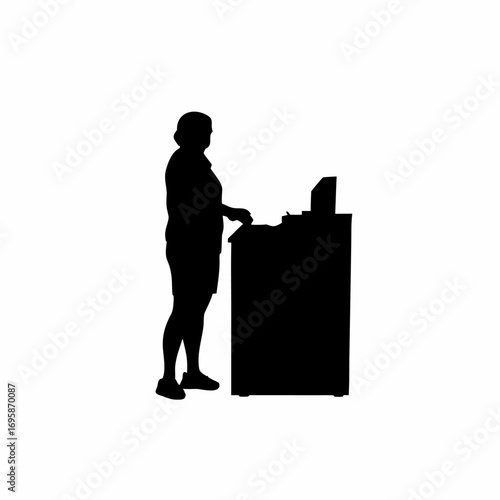 Silhouette of a cashier scanning products at a retail counter