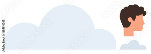 Profile of a mans head beside large and small clouds, suggesting thought, imagination, dreaming, cloud computing, connection, creativity, or innovation. Ideal for abstract concepts personal growth