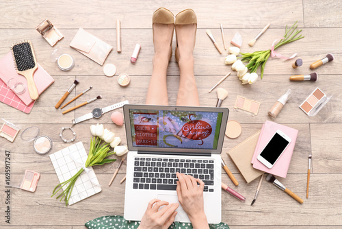 Woman with laptop, makeup p...