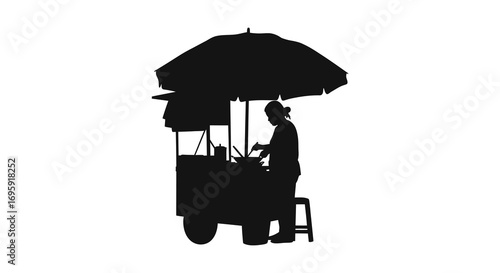 street vendor under umbrella selling goods at night market