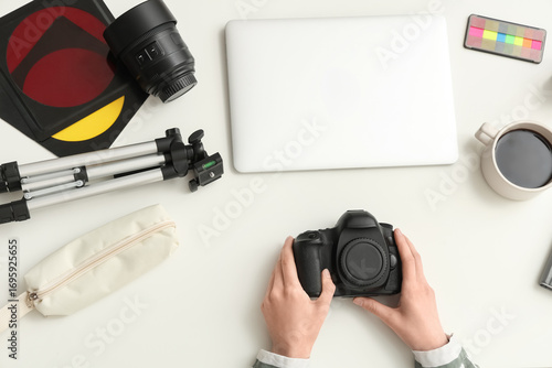 Hands of female photographe...