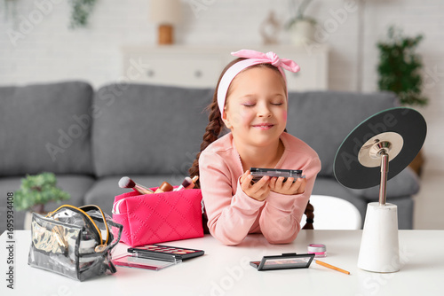 Cute little girl with palet...