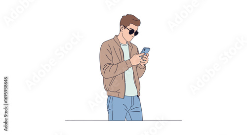 Young man engrossed in his smartphone, casually dressed, outdoors.