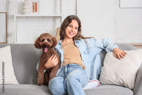 Teenage girl with Poodle do...