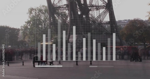 Tower legs dominating plaza at base, with translucent chart overlay and visitors holding cameras