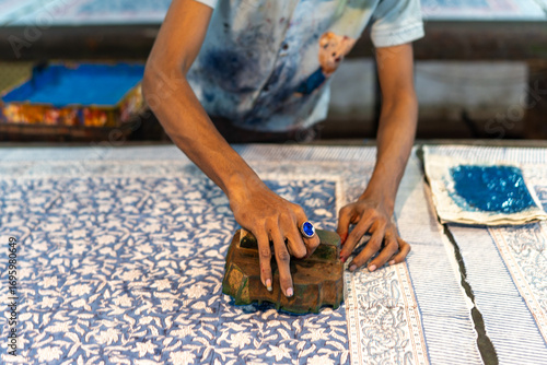Close-Up of Artisan Printing Fabric with Wooden Block in Jaipur,  Rajasthan, India