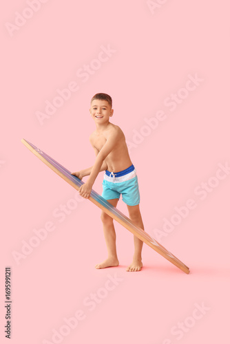 Cute little boy with surfin...