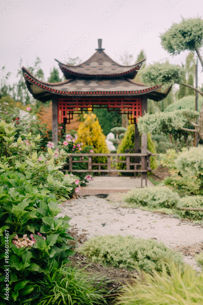 Fototapeta premium Charming Garden Shed with Lush Greenery and Blooming Flowers