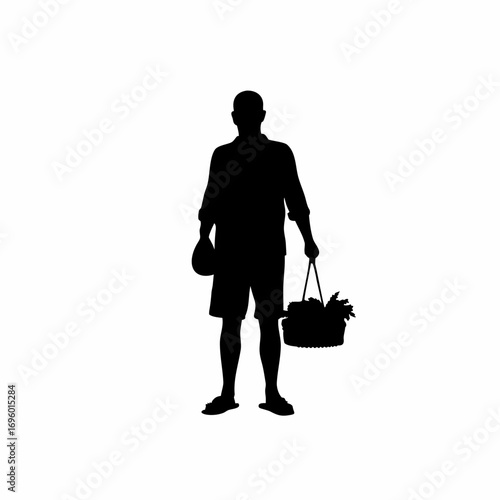 Silhouette of a vendor weighing fresh vegetables on a scale