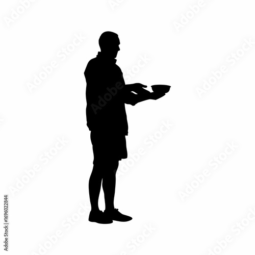 Silhouette of a caring volunteer serving food to people in need
