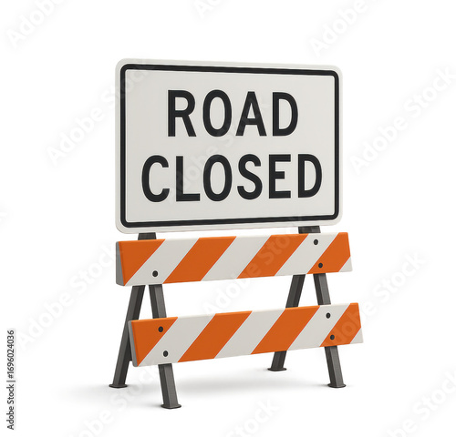 Road closed sign and barricade blocking traffic ahead