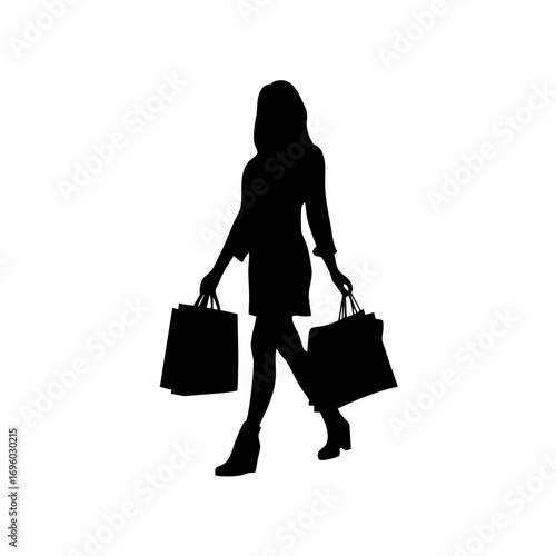 Silhouette of a woman carrying shopping bags after mall visit