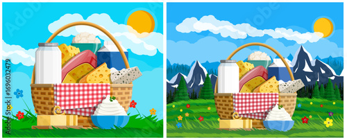 Cheese products in picnic basket on green grass. Food and beverage items with various dairy products. Rural background with mountains.