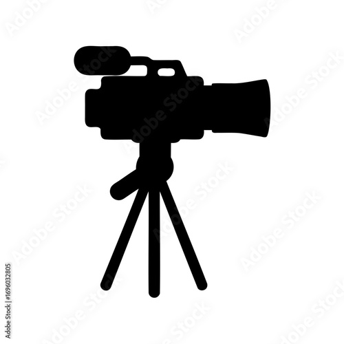 Silhouette of a professional video camera on a tripod stand, ready for action