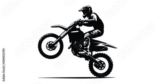 a motocross rider performing an impressive jump in silhouette