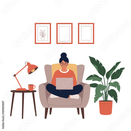 A woman working on her laptop while sitting comfortably in an armchair at home surrounded by plants and art