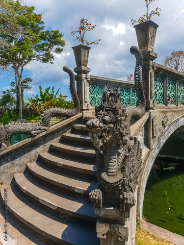 Closeup view of dragon statue on the bridge in Tirta Gangga temple, Bali