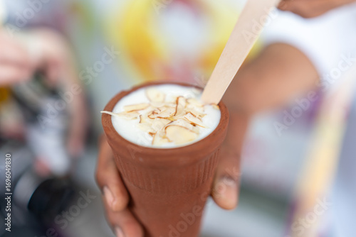 Traditional Sweet Lassi Served in a Clay Cup with Almond Topping in Jaipur, India