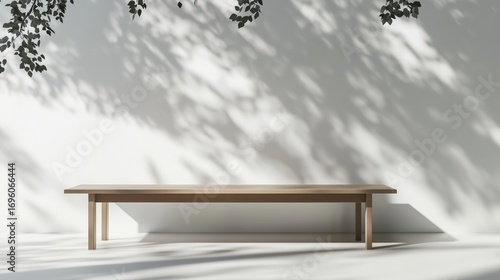 Minimalist Wooden Table Casts Shadows in a Tranquil Indoor Space During Dayli...