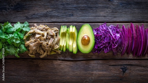 Fresh ingredients for a healthy salad include chopped cilantro, shredded avocado, ripe green slices,