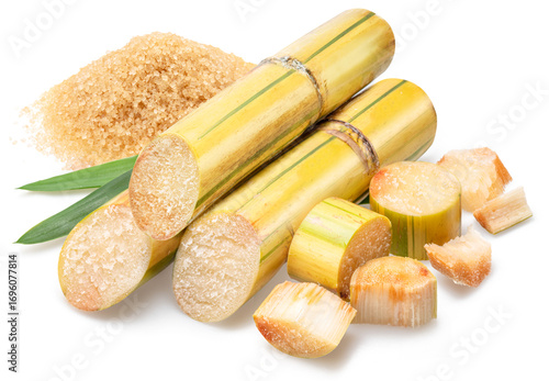 Sugarcane cuts and pile of brown sugar isolated on white background.
