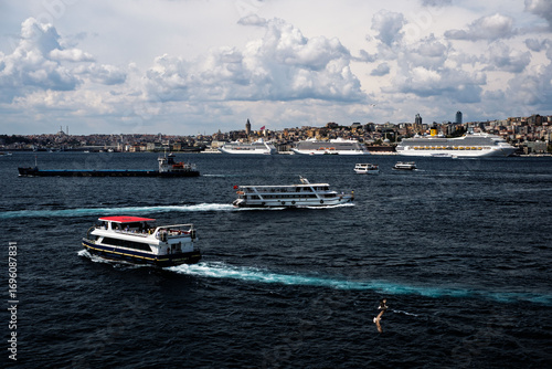 Costa Fortuna cruise ship and other little big ships on the Bosphorus of Istanbul. Ferries and passenger boats are visible cruising the Bosphorus, with large cruise ships in the background. Galata Tow