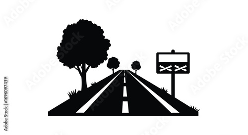 a road stretches forward with trees and a sign