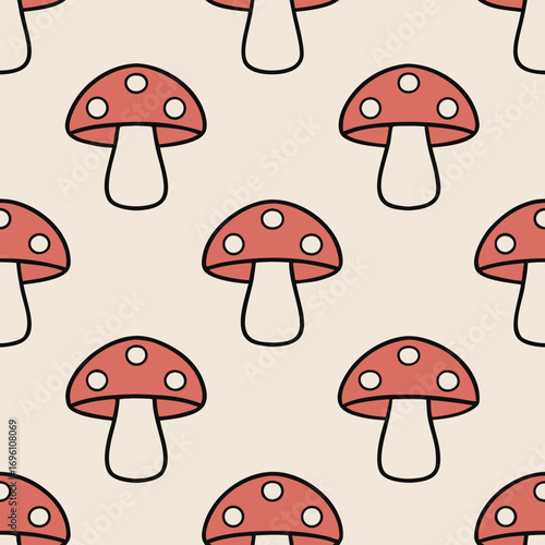 Seamless pattern of red mushrooms with white spots on a light green background