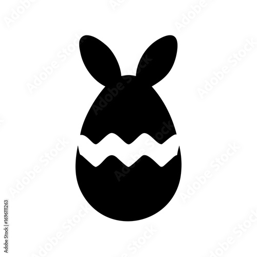 Silhouette of broken Easter egg with bunny ears emerging from the top