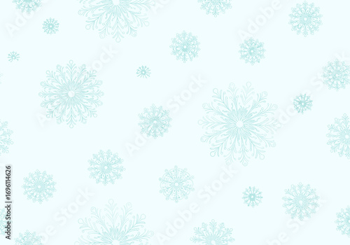 Delicate ice crystals adorning a serene winter landscape with gentle falling snowflakes