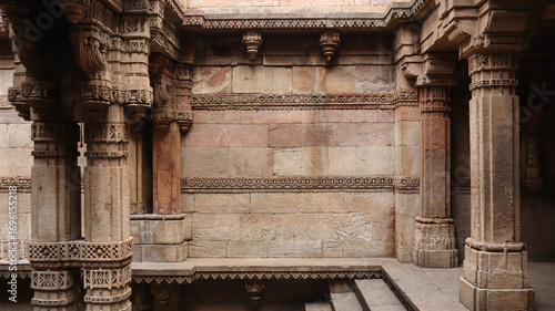 India, Gujarat, Ahmedabad, Beautiful Carvings on the Pillars and Wall of Adalaj Stepwell, Late 15th Century Carvings During Vaghela Dynasty of Gujarat.
