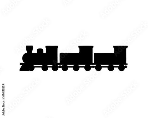 Silhouette of a vintage steam train with several cargo cars trailing behind