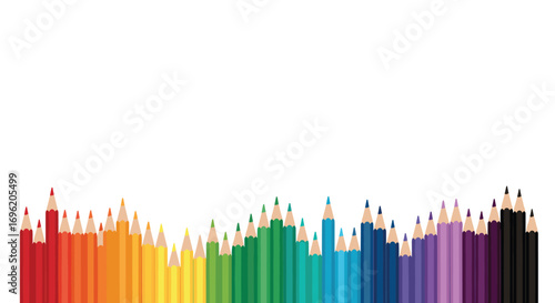 Vibrant spectrum of colored pencils arranged in a dynamic wavy line pattern on a white background