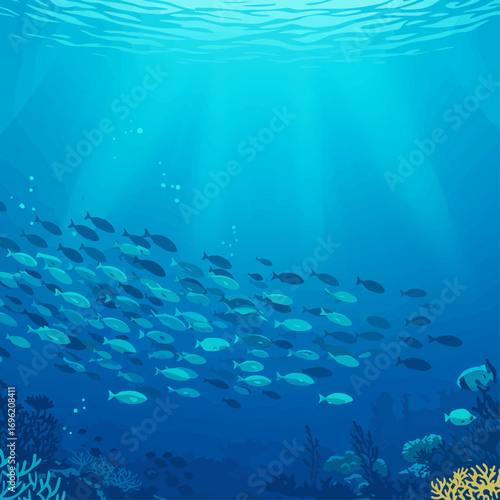A large school of fish swims together in the deep blue ocean, with sunlight filtering down from the surface and coral reefs visible below.