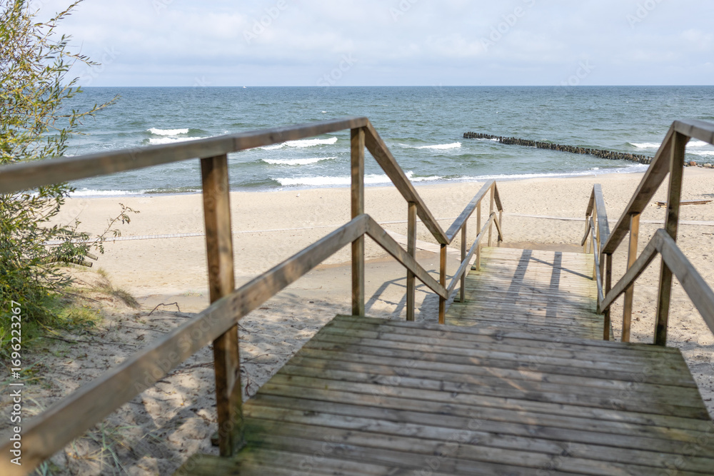 Fototapeta premium wooden stairs leading to the baltic sea