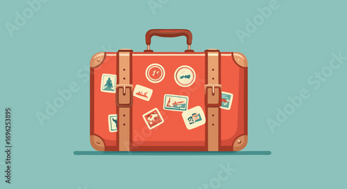 Vintage red travel suitcase with buckled leather straps and destination stickers.