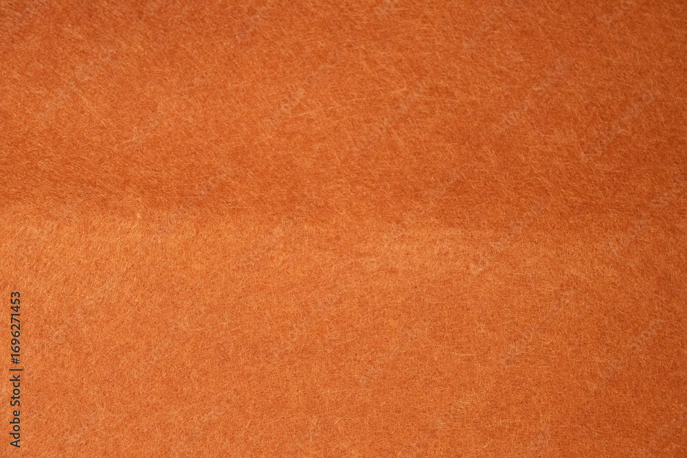 Fototapeta premium Soft orange felt texture background for design and creative use