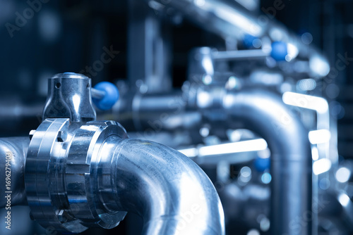 Fotografie Industrial beer production pipes and valves in brewery factory