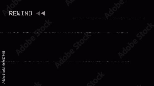 Analog television showing vertical VHS rewind animation, with REWIND text, static interference, glitch effects, and screen artifacts on a black background.