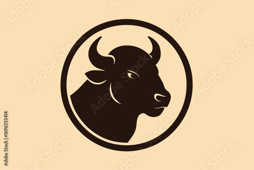 Silhouette of a strong bull head inside a circular frame, powerful symbol.