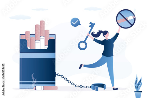 Happy woman with big key. Female smoker opened shackles and got rid of smoking addiction. Girl is not chained to huge cigarette pack. Problem of addiction to smoking and nicotine.
