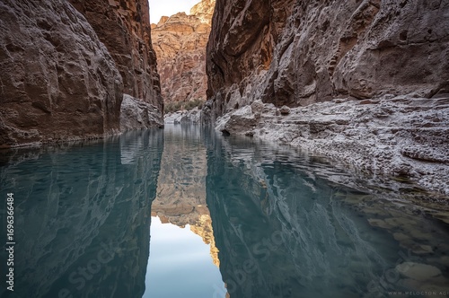 Thermal Spring Pools Mirroring in a Remote, Craggy Canyon - Soothing Desert Waters Experience