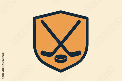 Hockey Emblem with Crossed Sticks and Puck Inside a Shield.