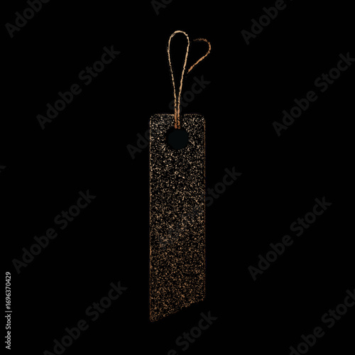 Textured black tag with a looped cord hanging against a dark background, showcasing its subtle elegance and modern design details