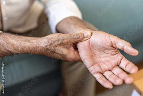 Hands, check pulse and heart rate, health and senior person with cardiovascular healthcare. Help, support and medical aid, closeup and monitor heartbeat with cardiology and elderly care for wellness.