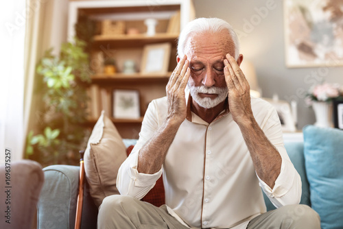 Stress, headache and senior man in home with worrying, overthinking or mental health. Anxiety, mistake and elderly male person with migraine in living room for regret, vertigo or brain fog in house.